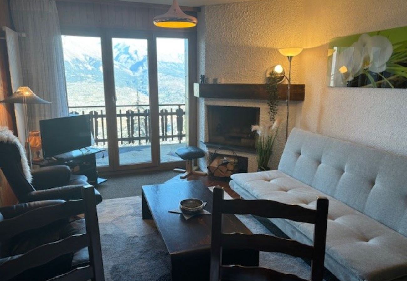 Living room of the apartment Les Mélèzes K 021 in Veysonnaz in Switzerland